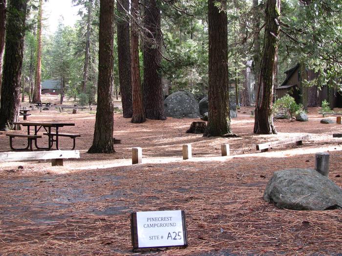 Paved site with picnic table and fire ringPinecrest Campground Site A25
