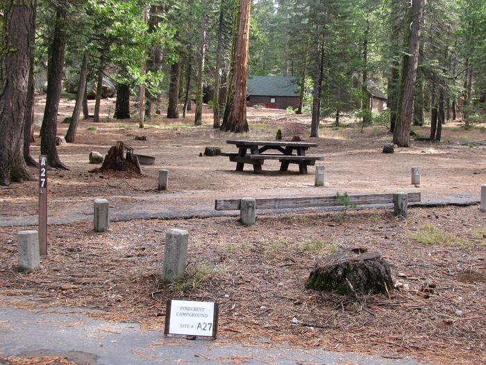Paved site with picnic table and fire ringPinecrest Campground Site A27