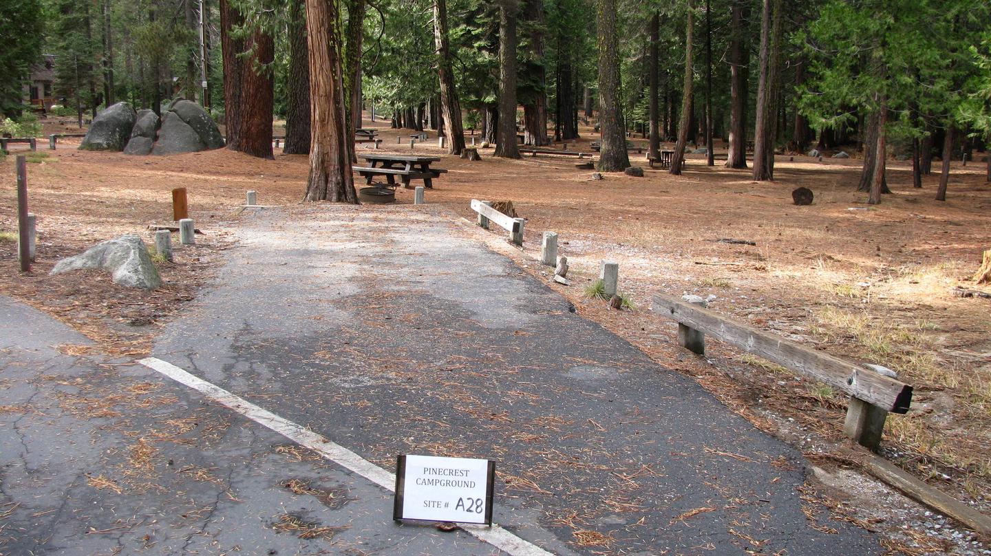 Paved site with picnic table and fire ringPinecrest Campground Site A28