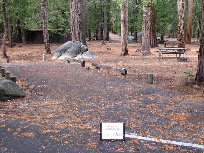Paved site with picnic table and fire ringPinecrest Campground Site A29