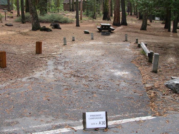 Paved site with picnic table and fire ringPinecrest Campground Site A30