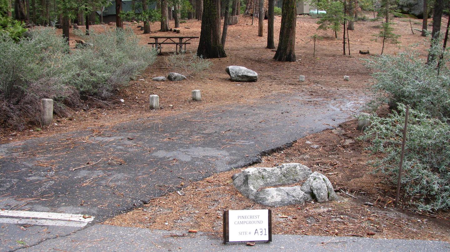 Paved site with picnic table and fire ringPinecrest Campground Site A31