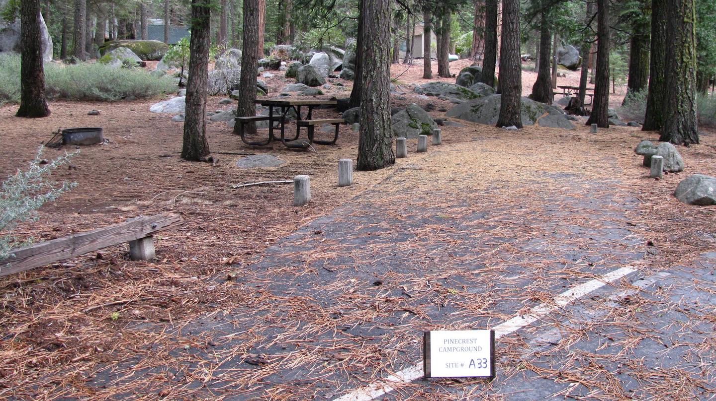 Paved site with picnic table and fire ringPinecrest Campground Site A33