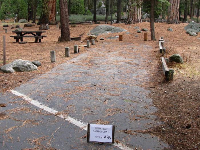 Paved site with picnic table and fire ringPinecrest Campground Site A35