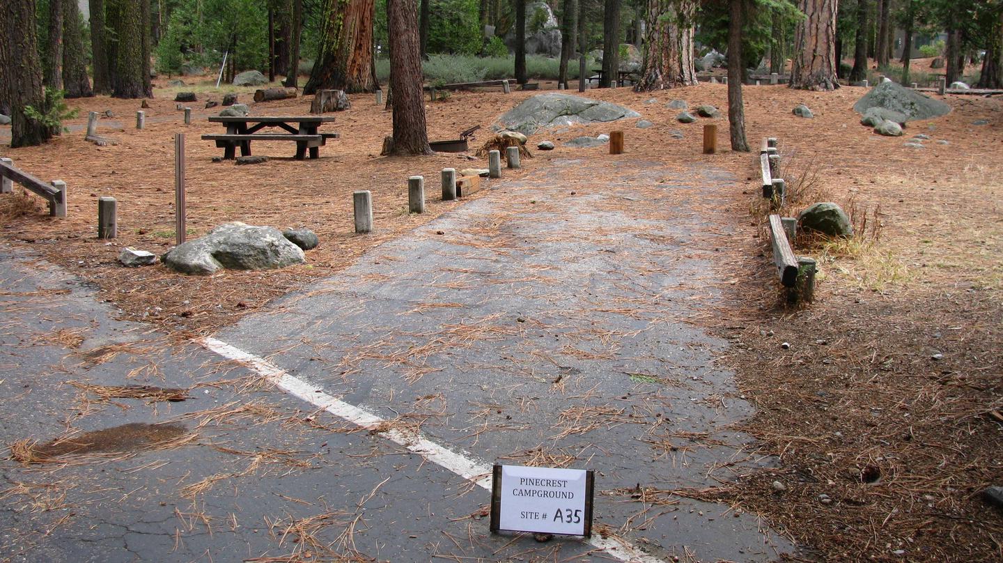 Paved site with picnic table and fire ringPinecrest Campground Site A35