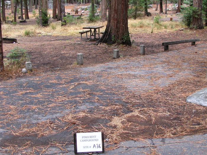 Paved site with picnic table and fire ringPinecrest Campground Site A36
