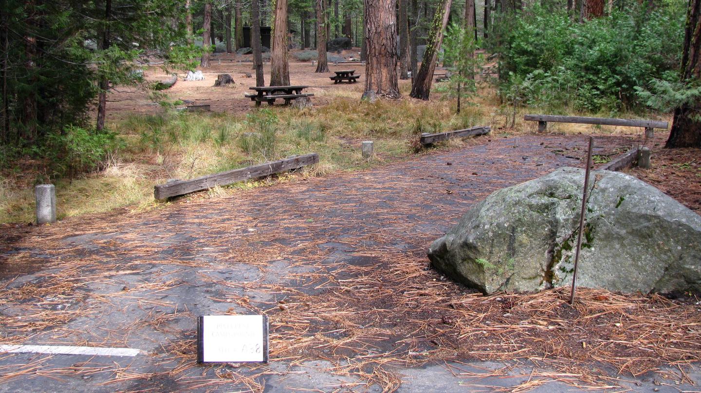 Paved site with picnic table and fire ringPinecrest Campground Site A38