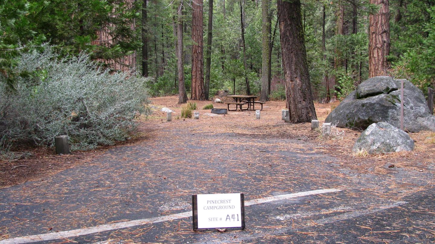 Paved site with picnic table and fire rindPinecrest Campground Site A41