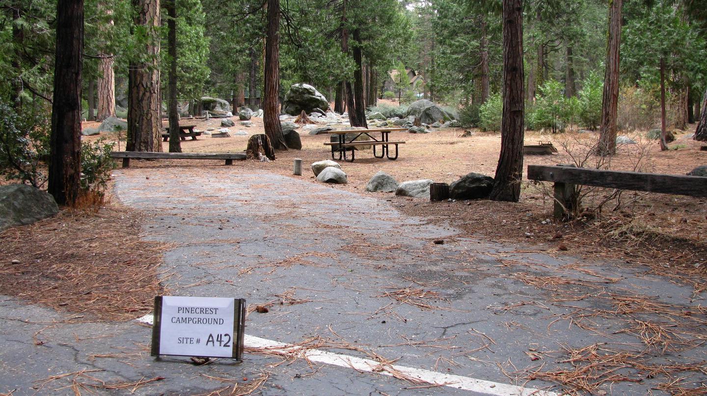 Paved site with picnic table and fire ringPinecrest Campground Site A42