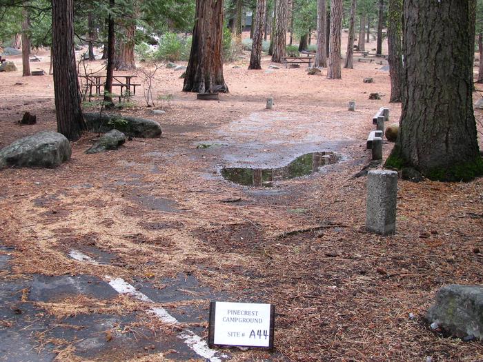 Paved site with picnic table and fire ringPinecrest Campground Site A44
