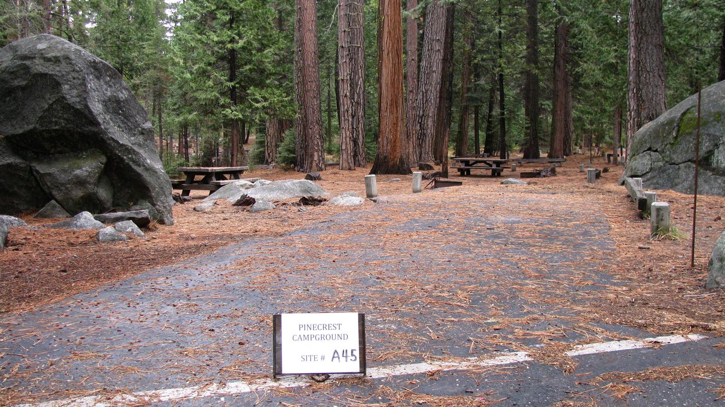 Paved site with picnic table and fire ringPinecrest Campground Site A45