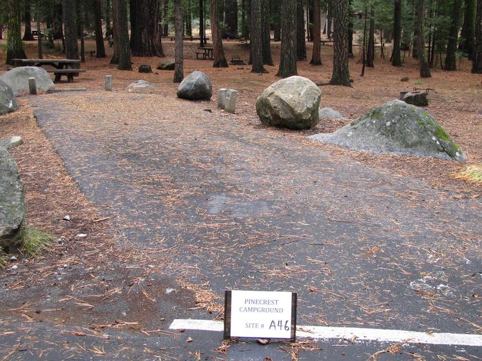 Paved site with picnic table and fire ringPinecrest Campground Site A46