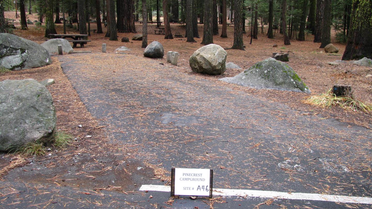 Paved site with picnic table and fire ringPinecrest Campground Site A46