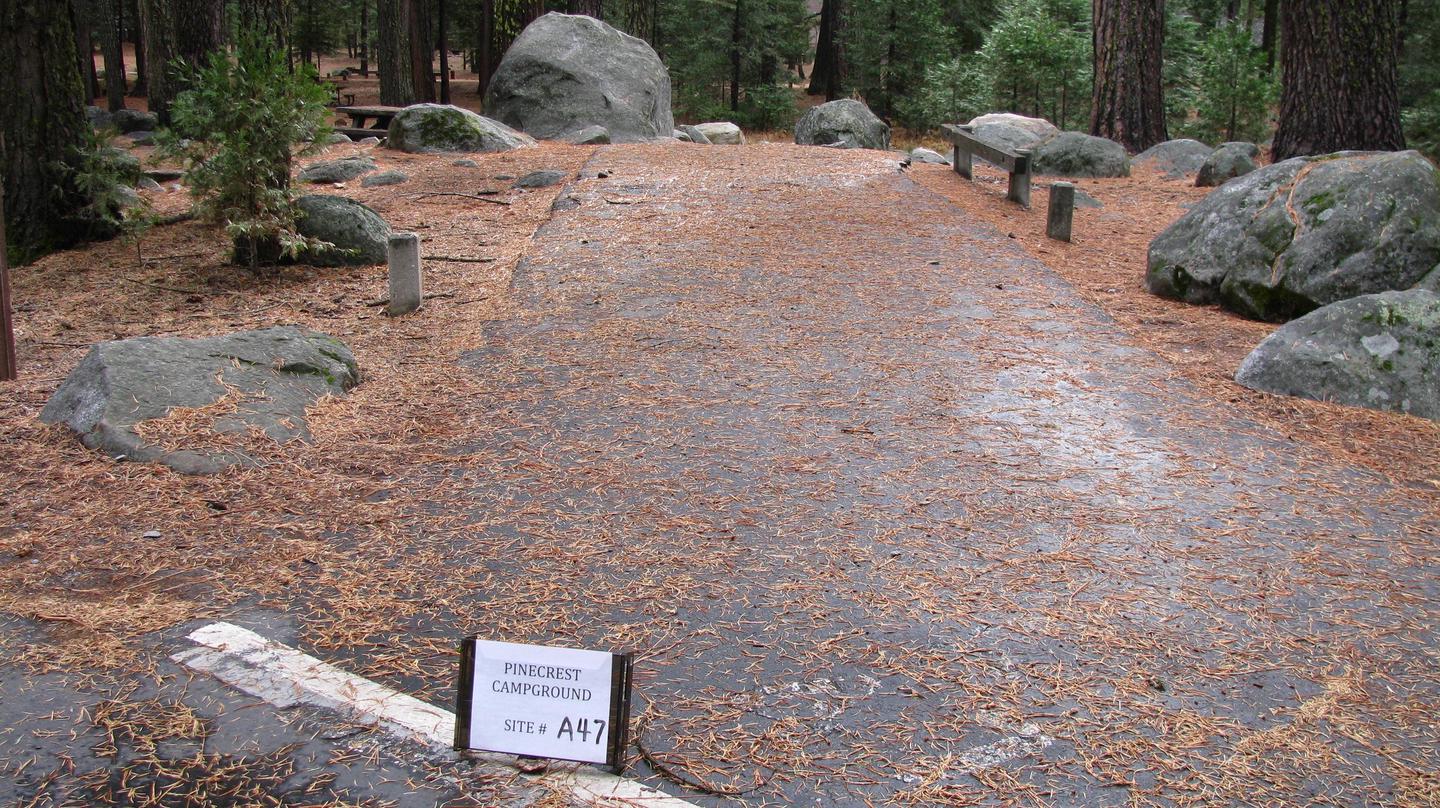 Paved site with picnic table and fire ringPinecrest Campground Site A47
