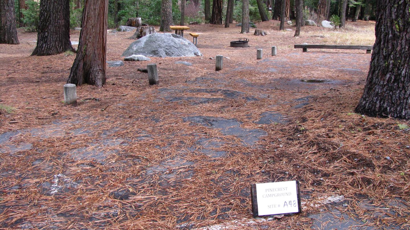 Paved site with picnic table and fire ringPinecrest Campground Site A48