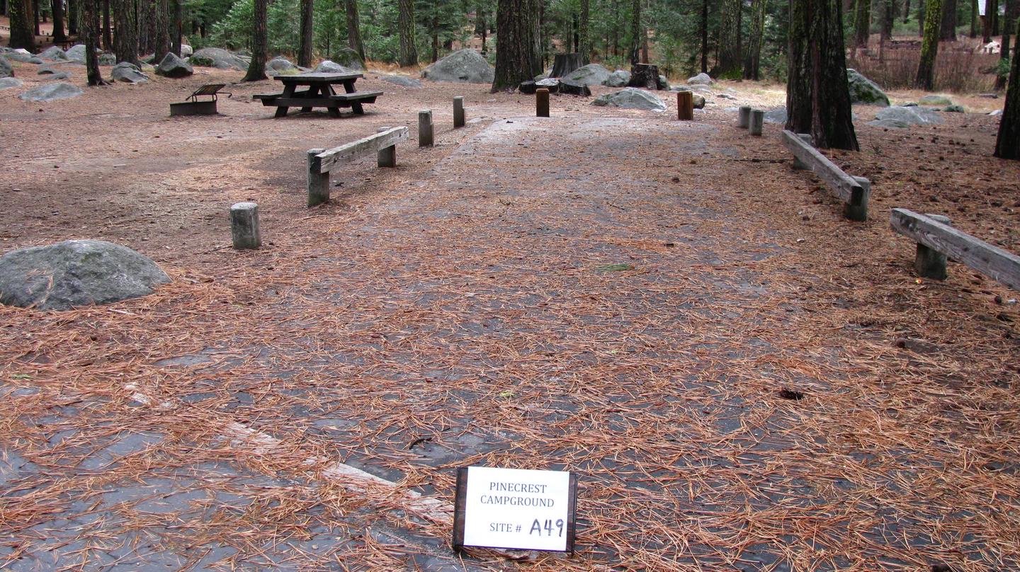 Paved site with picnic table and fire ringPinecrest Campground Site A49