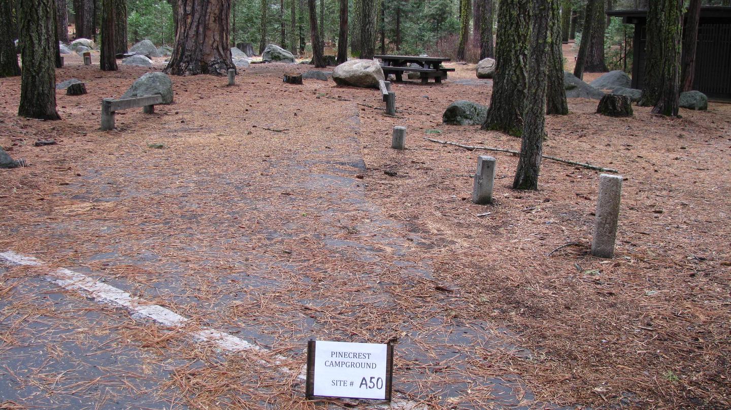 Paved site with picnic table and fire ringPinecrest Campground Site A50