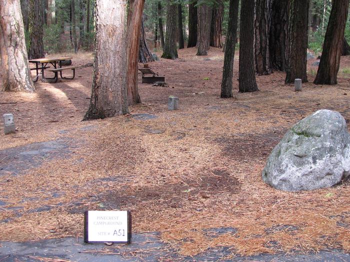 Paved site with picnic table and fire ringPinecrest Campground Site A51