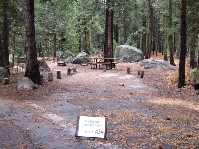 Paved site with picnic table and fire ringPinecrest Campground Site A54