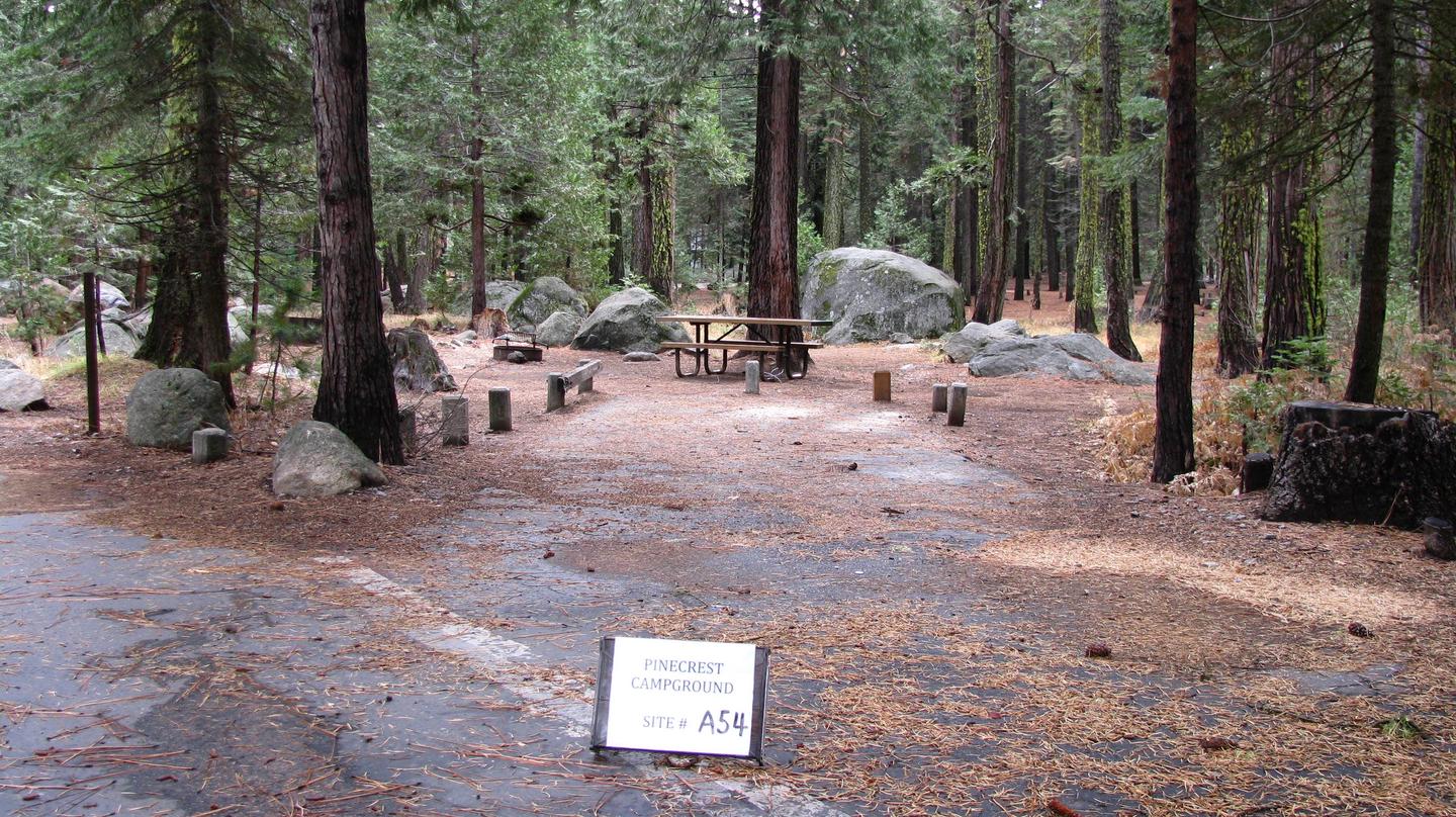 Paved site with picnic table and fire ringPinecrest Campground Site A54