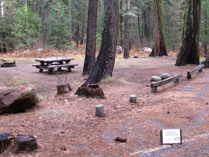 Paved site with picnic table and fire ringPinecrest Campground Site A55