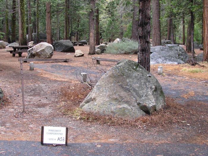 Paved site with picnic table and fire ringPinecrest Campground Site A58