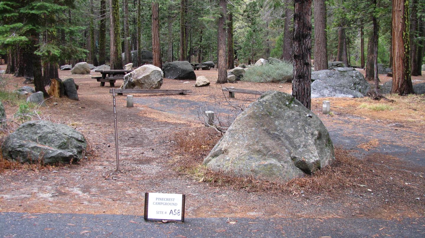 Paved site with picnic table and fire ringPinecrest Campground Site A58