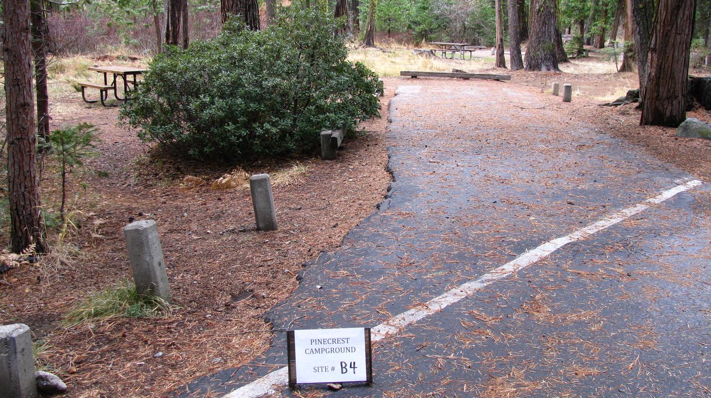 Paved site with picnic table and fire ringPinecrest Campground Site B4