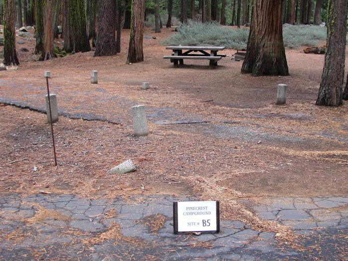 Paved site with picnic table and fire ringPinecrest Campground Site B5
