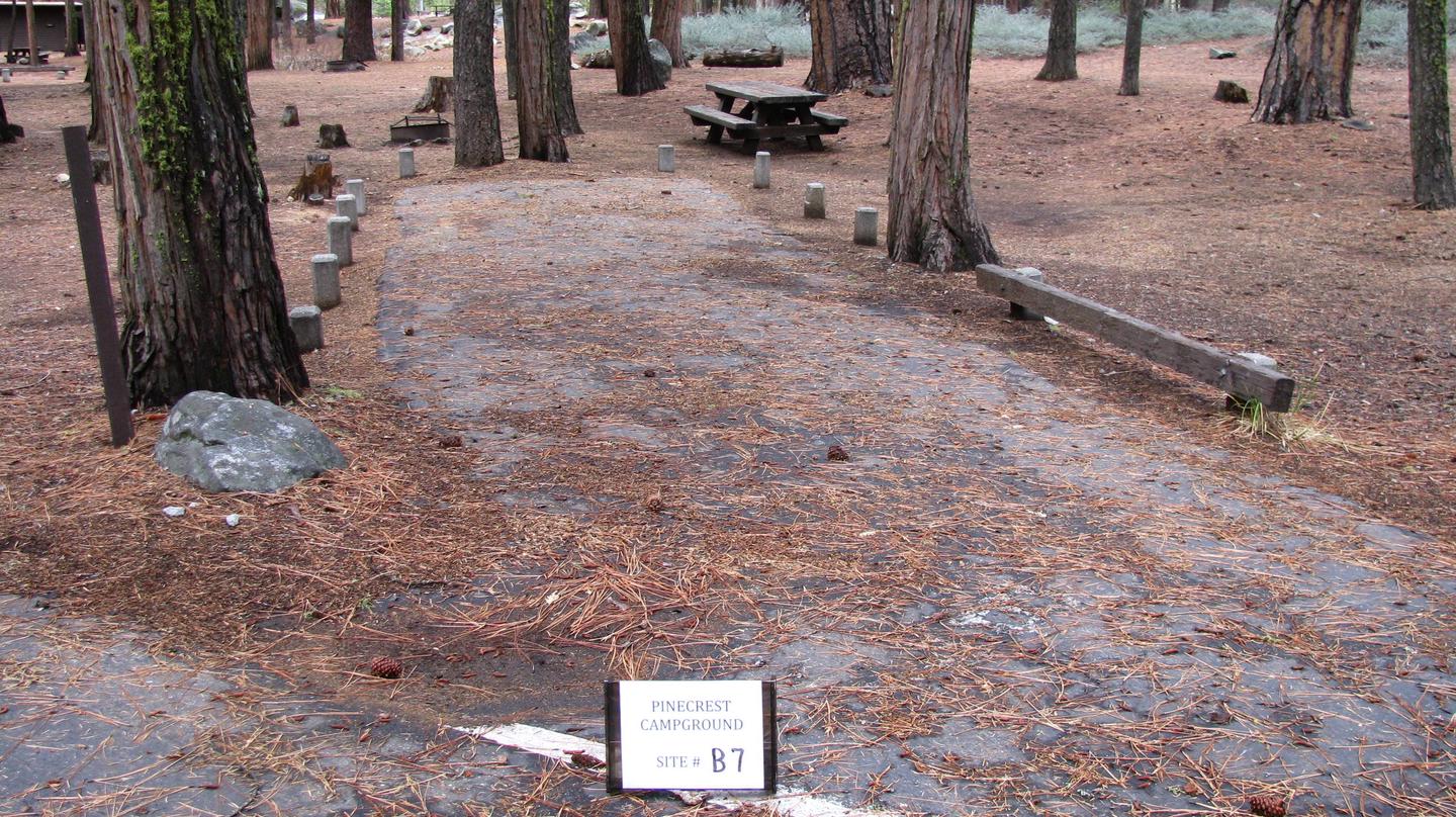 Paved site with picnic table and fire ringPinecrest Campground Site B7
