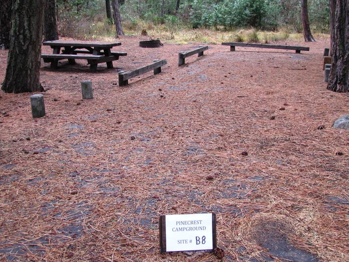 Paved site with picnic table and fire ringPinecrest Campground Site B8