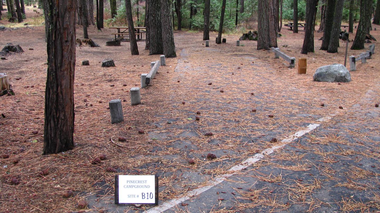 Paved site with picnic table and fire ringPinecrest Campground Site B10