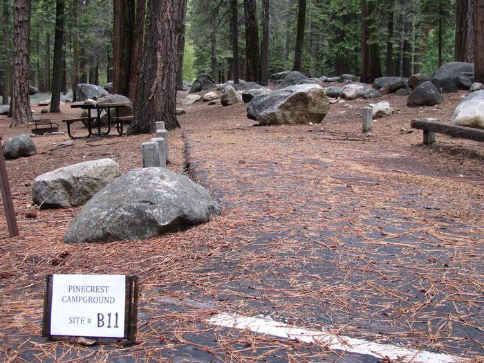 Paved site with picnic table and fire ringPinecrest Campground Site B11