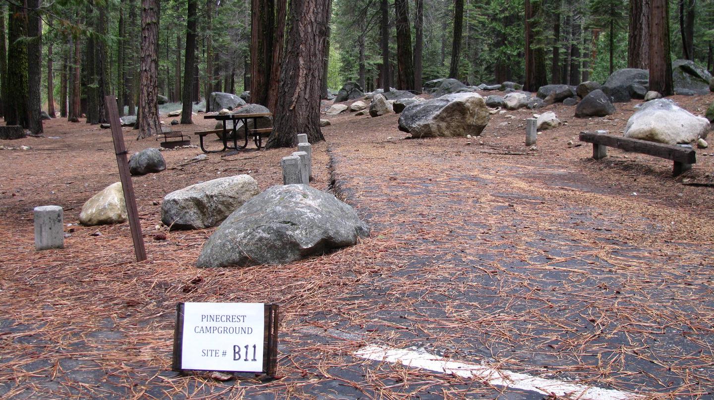 Paved site with picnic table and fire ringPinecrest Campground Site B11
