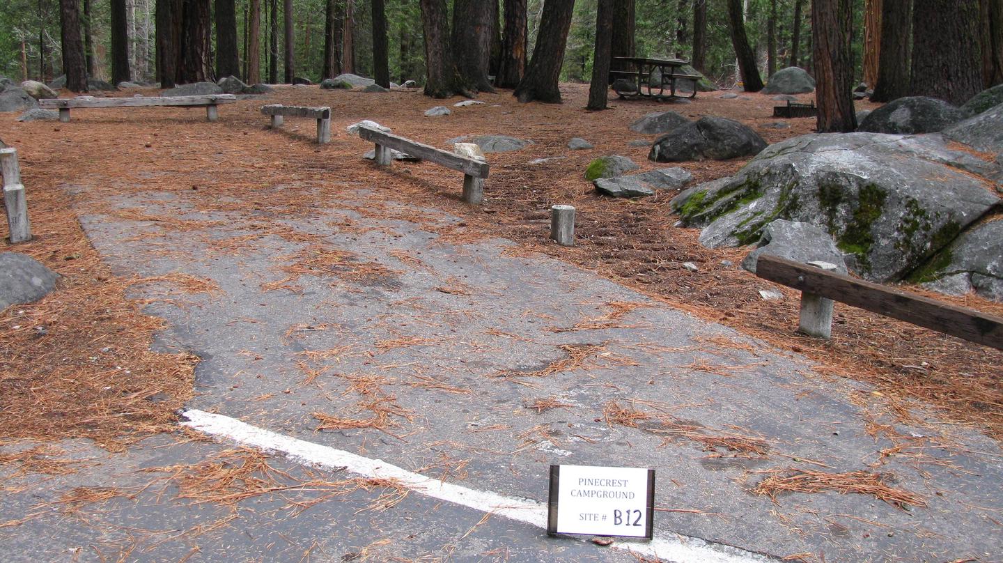 Paved site with picnic table and fire ringPinecrest Campground Site B12