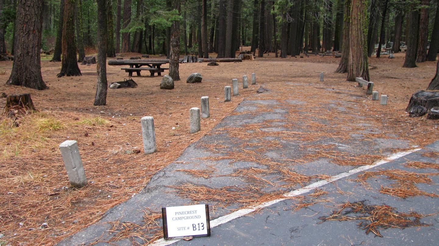 Paved site with picnic table and fire ringPinecrest Campground Site B13