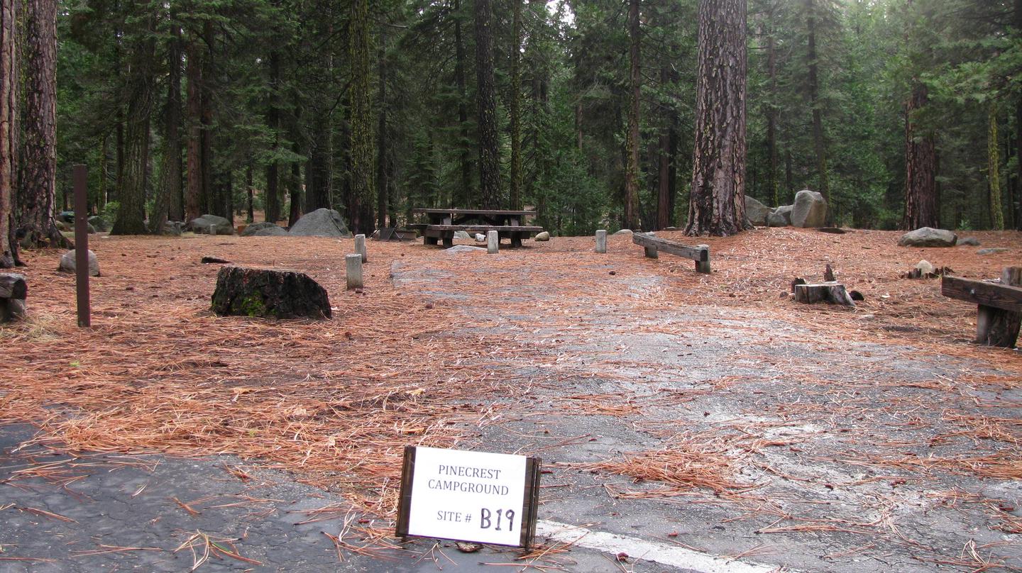 Paved site with picnic table and fire ringPinecrest Campground Site B19
