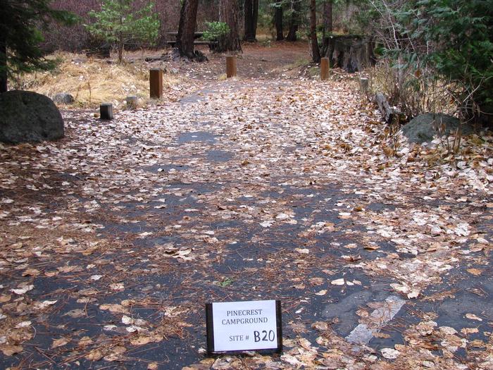 Paved site with picnic table and fire ringPinecrest Campground Site B20