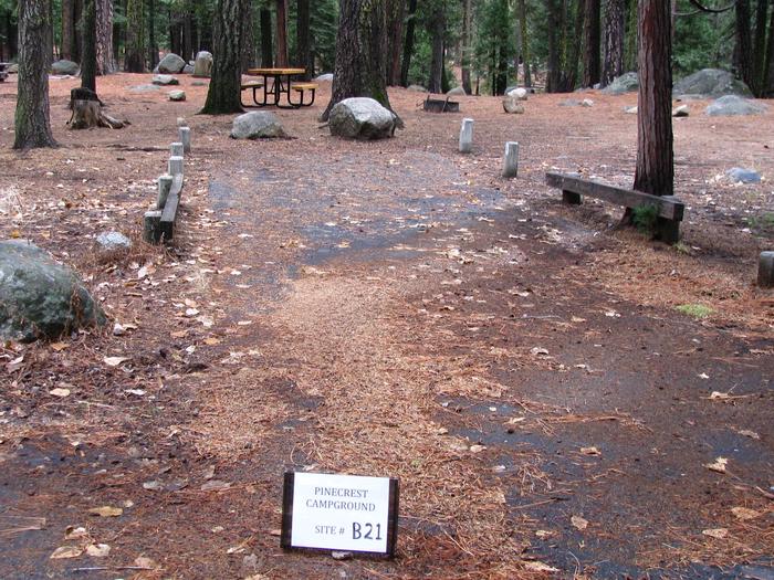 Paved site with picnic table and fire ringPinecrest Campground Site B21