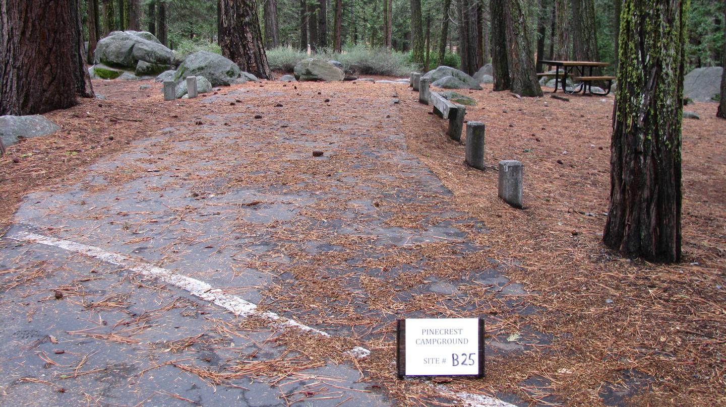 Paved site with picnic table and fire ringPinecrest Campground Site B25
