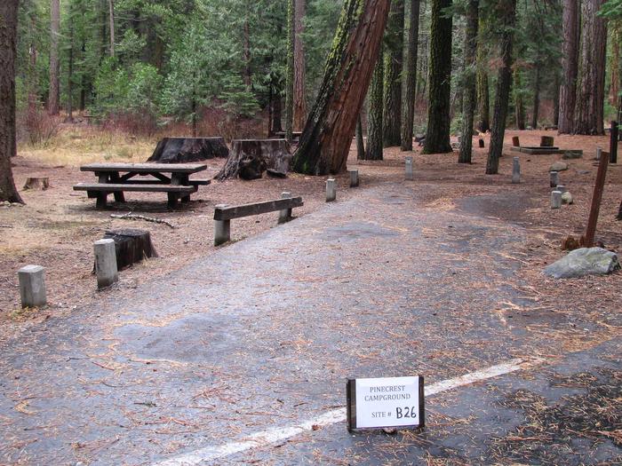 Paved site with picnic table and fire ringPinecrest Campground Site B26