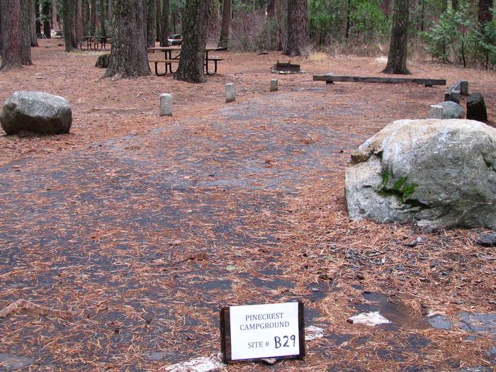 Paved site with picnic table and fire ringPinecrest Campground Site B29