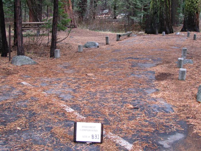 Paved site with picnic table and fire ringPinecrest Campground Site B31