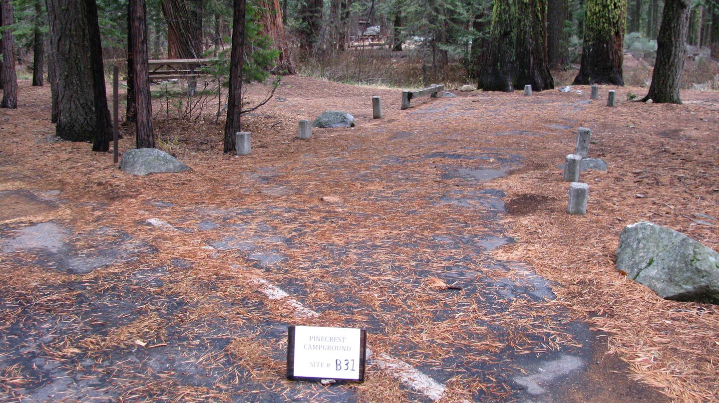 Paved site with picnic table and fire ringPinecrest Campground Site B31