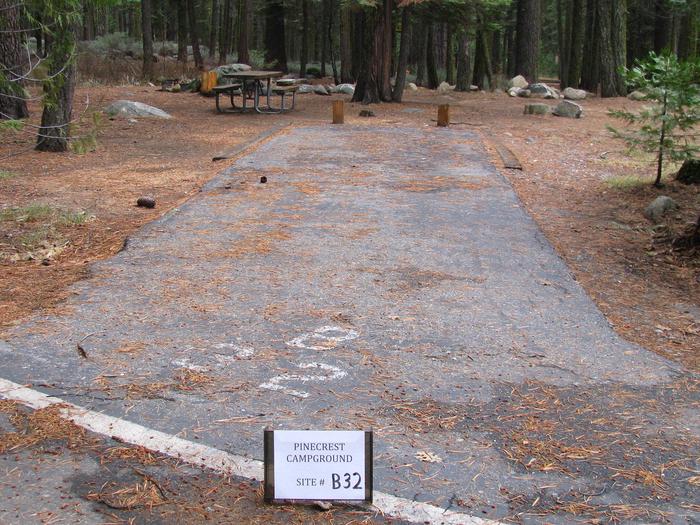 Paved site with picnic table and fire ringPinecrest Campground Site B32