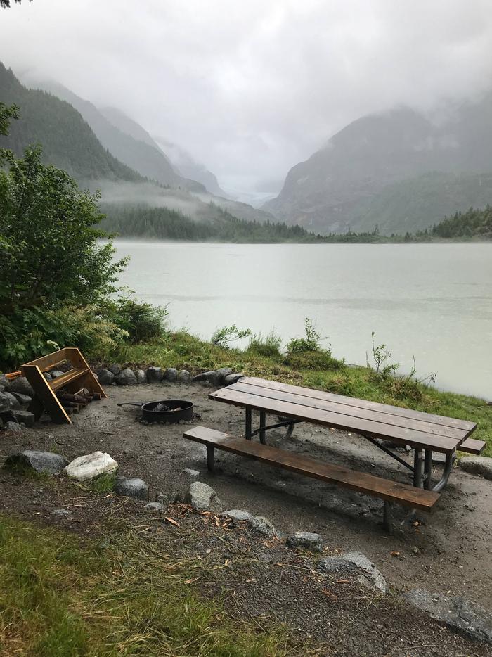 Picnic table and fire pit with view of Eagle Glacier