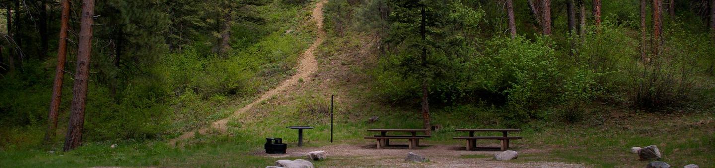 Sites have picnic table, BBQ stand, firepit, tent pad and lantern holders with hiking trails nearby.Dog Creek Campground