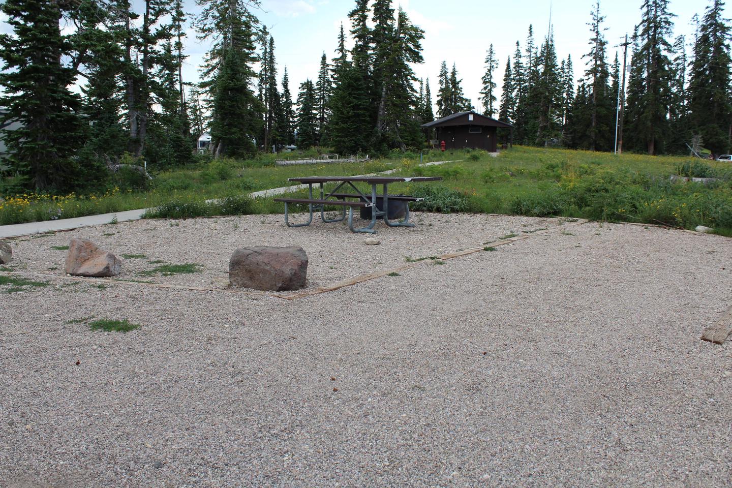 Site 22: Picnic Table, paved path to restroom and parking area. 