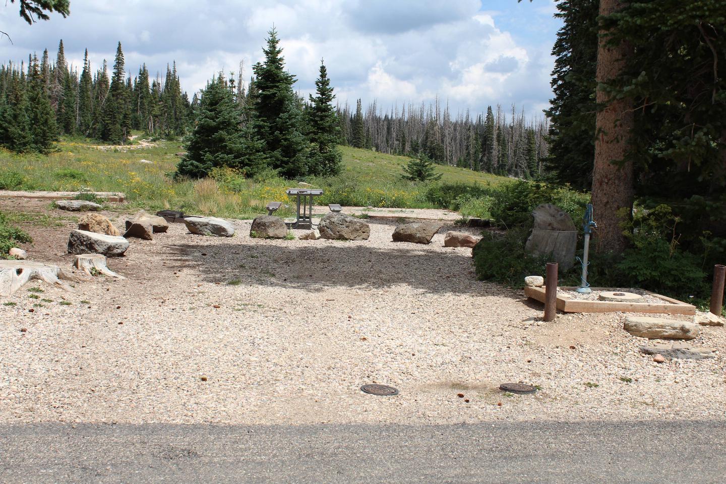 Site 23: Parking area, water spigot, table, tent-pad and fire pit. 