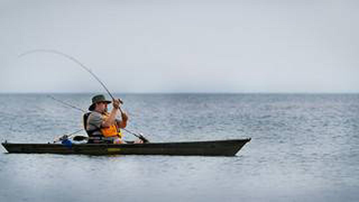Park Ranger fishing during a program at Indiana Dunes National Park.
